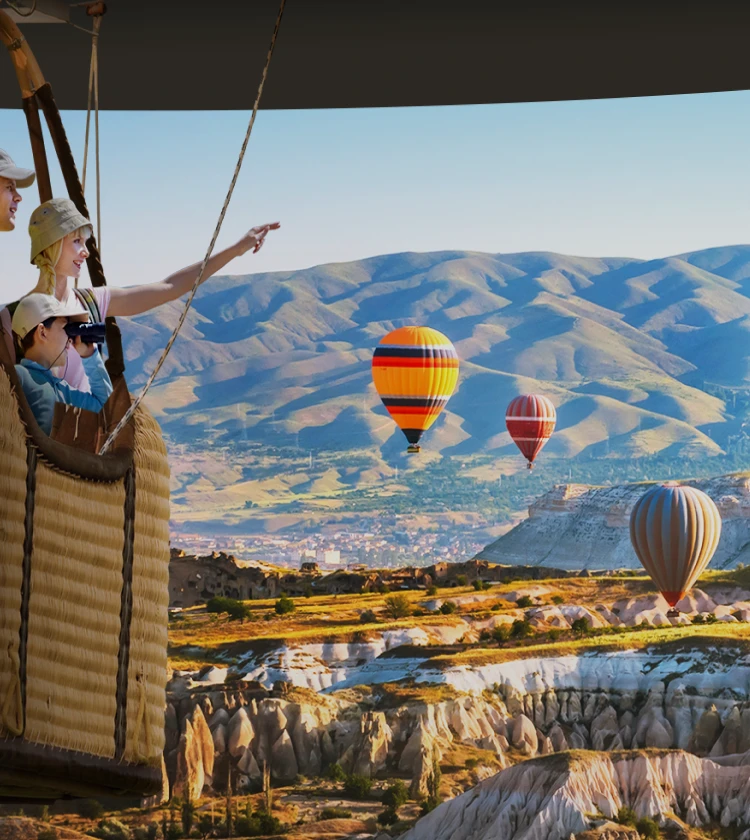 AUO Creative LED Display showcasing an immersive scene of hot air balloons floating over a picturesque canyon landscape, viewed from a balloon basket)